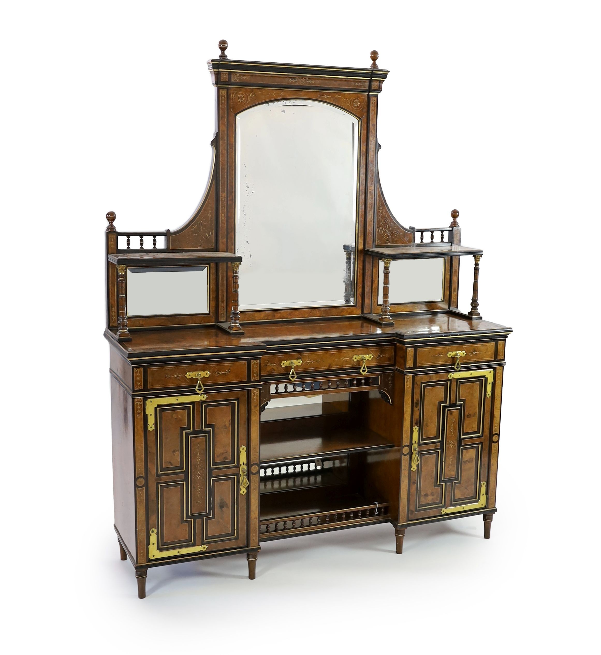 Henry William Batley (1846-1932) for Shoolbred & Co. A Victorian aesthetic movement walnut and ebonised chiffonier, W.168cm D.47cm H.204cm